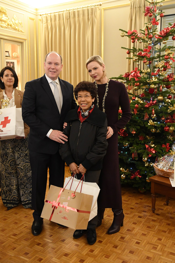 Princess Charlene of Monaco and Prince Albert II of Monaco attend Christmas gifts distribution red cross