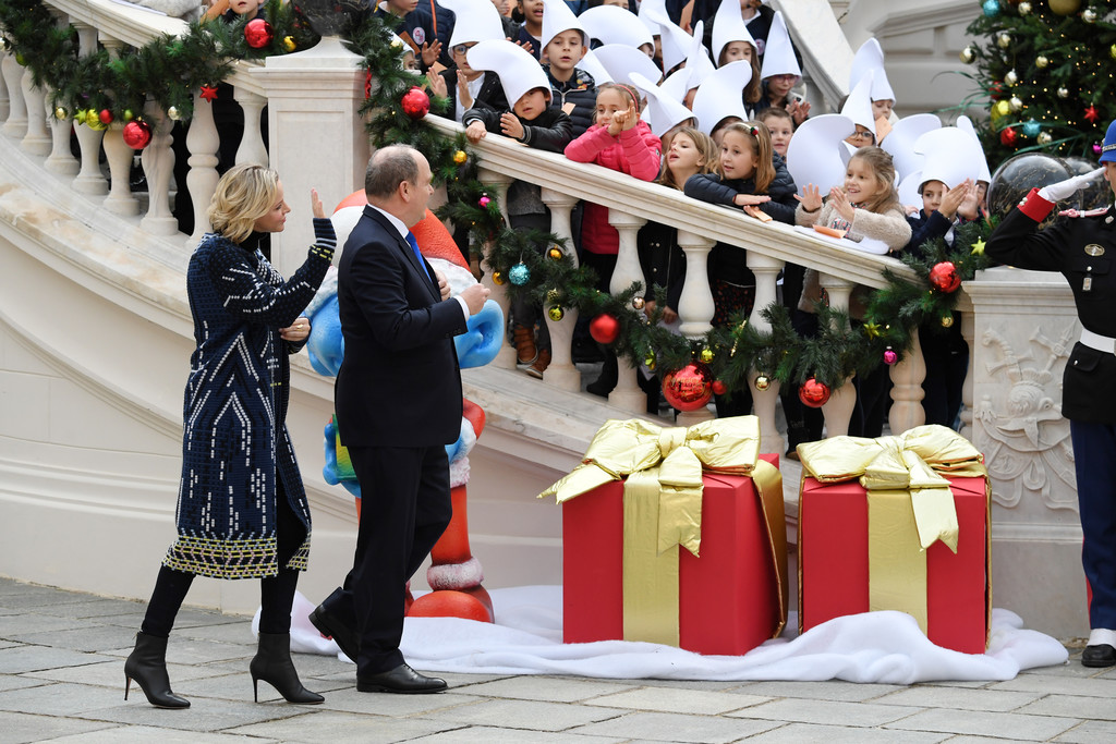 Princess Charlene of Monaco and Prince Albert II of Monaco attend the children Christmas Gifts