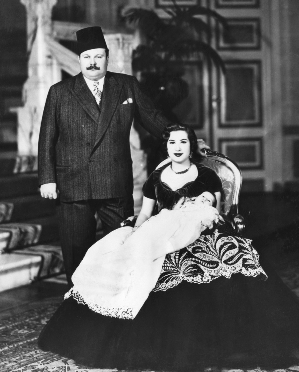 King Farouk and Queen Narriman with Prince Fuad in an official photo